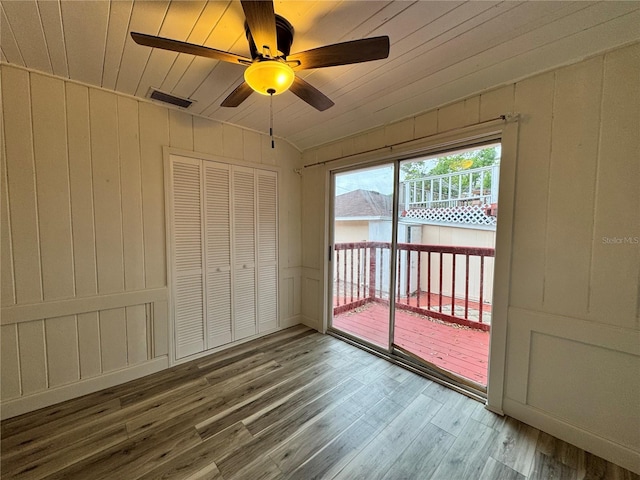 interior space featuring visible vents, ceiling fan, wood ceiling, wood finished floors, and vaulted ceiling