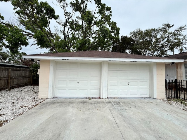 garage featuring fence