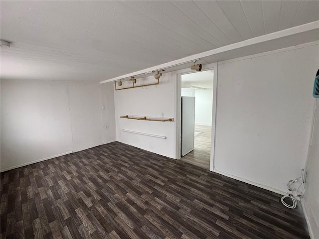 spare room with dark wood-style floors