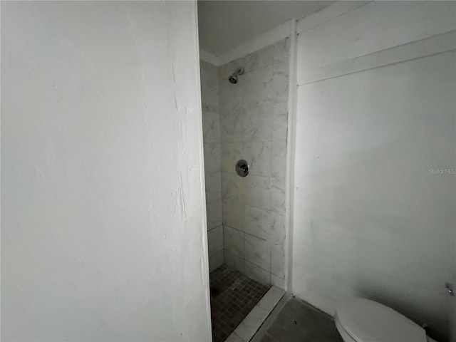 full bath with toilet and a shower stall