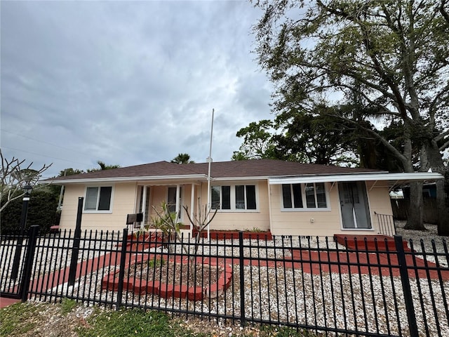 ranch-style house with a fenced front yard