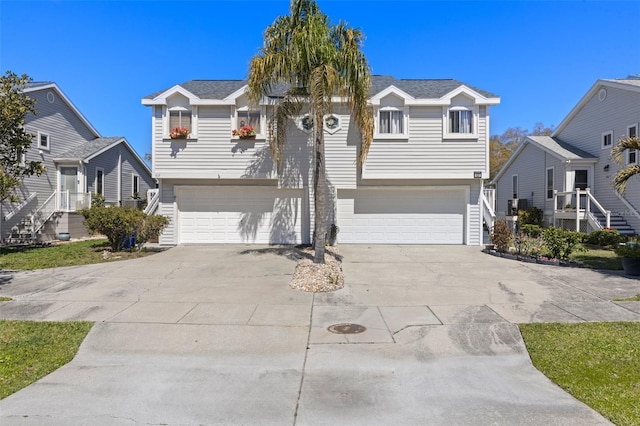 view of front facade with a garage and concrete driveway