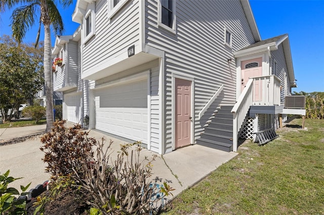 view of side of property featuring an attached garage