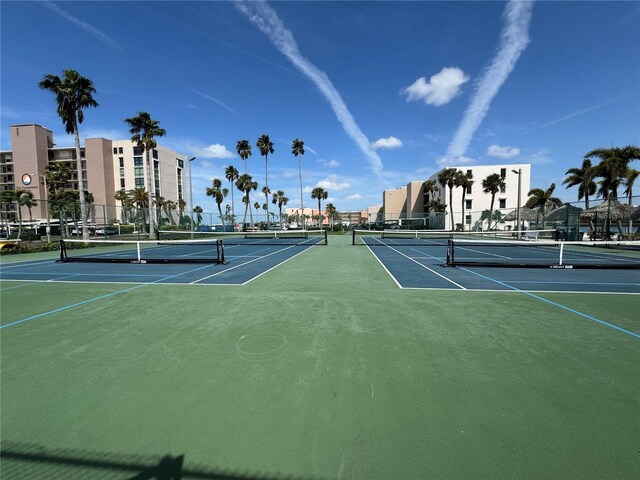 view of sport court featuring fence