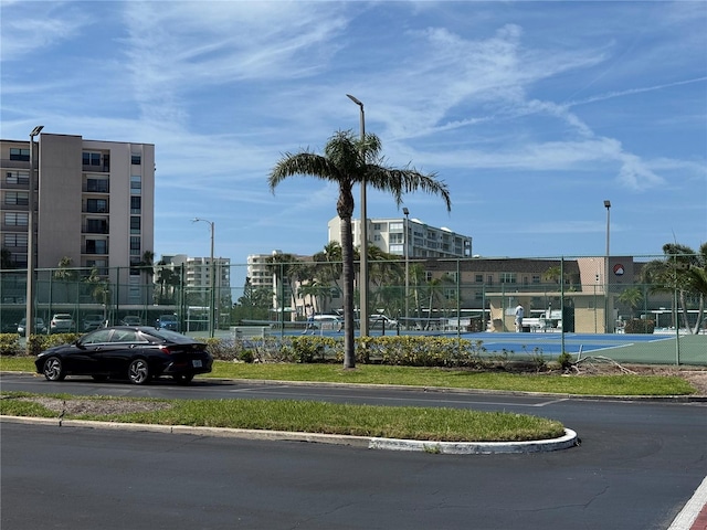 view of road featuring street lights and curbs