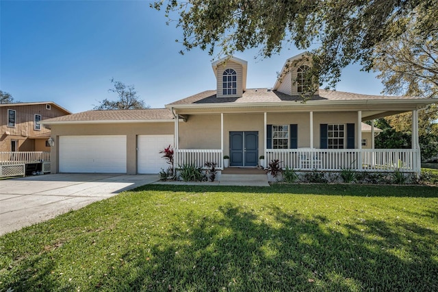 view of front of property featuring stucco siding, a garage, a porch, and a front yard