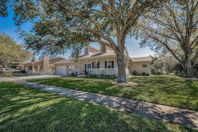 view of front of house featuring a front lawn, a porch, stucco siding, driveway, and an attached garage