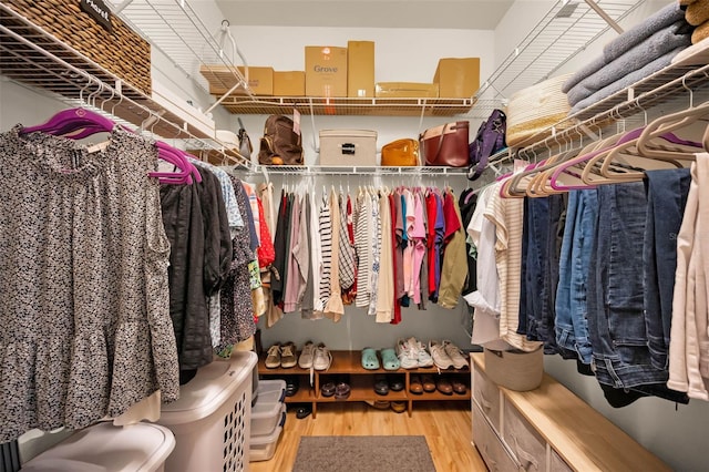 spacious closet with wood finished floors