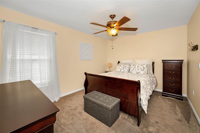 bedroom with carpet flooring, ceiling fan, and baseboards