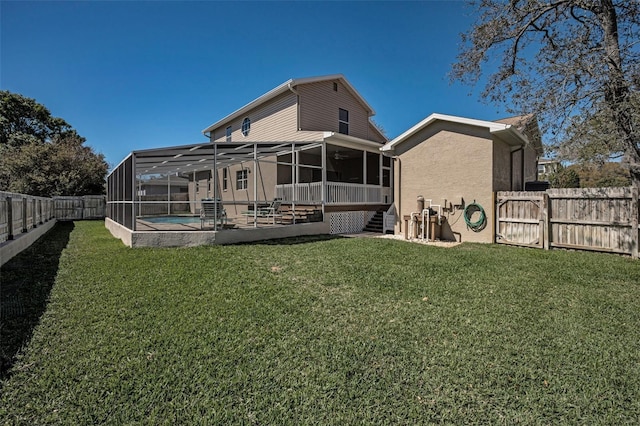 back of house featuring a patio, a fenced in pool, a yard, a fenced backyard, and stucco siding