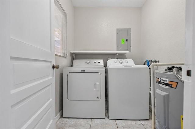 clothes washing area with laundry area, electric panel, and washer and dryer