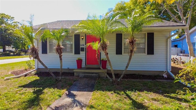 bungalow-style house with roof with shingles