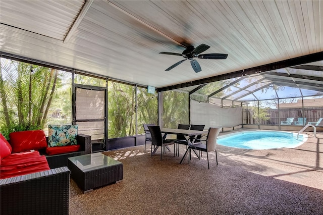 view of pool with an outdoor living space, glass enclosure, a patio, and a fenced in pool