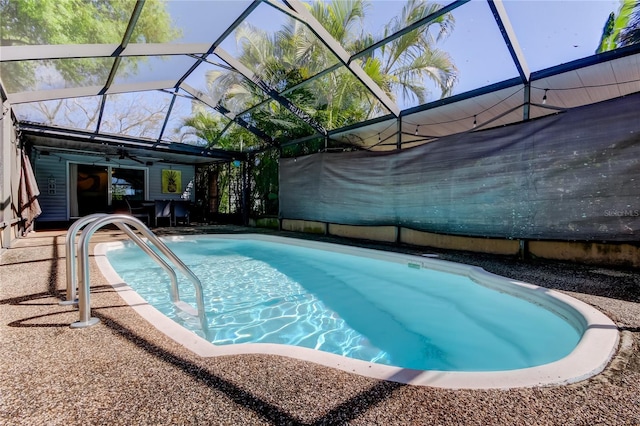 pool featuring a lanai and a patio