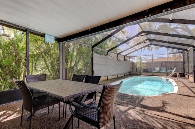 view of pool with glass enclosure, a fenced in pool, a fenced backyard, and a patio area