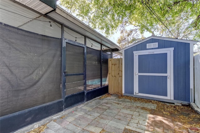 view of shed with fence