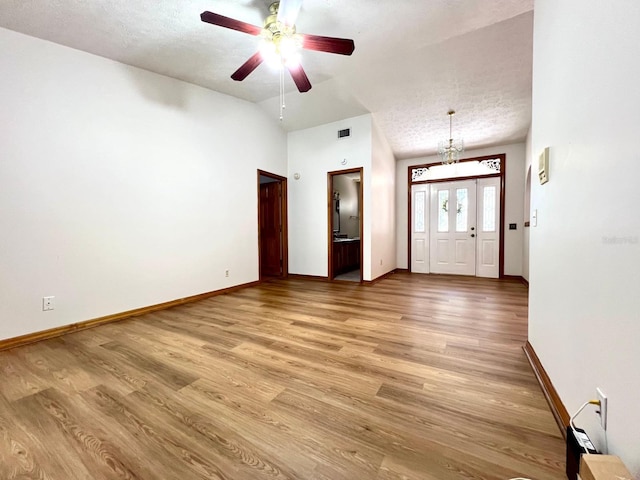 1811 Tawnee Pl, Brandon, FL 33510 - foyer featuring light wood-style floors, ceiling fan, visible vents, baseboards, and lofted ceiling