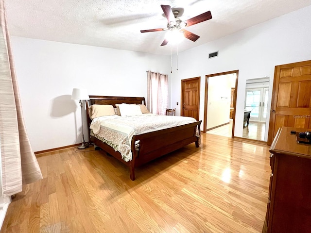 1811 Tawnee Pl, Brandon, FL 33510 - bedroom with a textured ceiling, light wood-style flooring, visible vents, ceiling fan, and baseboards