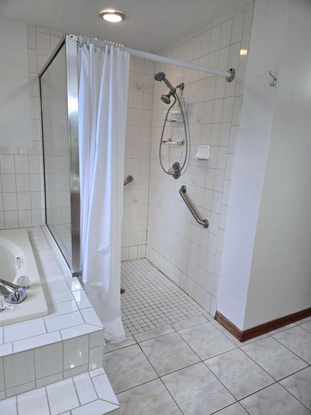 1811 Tawnee Pl, Brandon, FL 33510 - bathroom with tile patterned floors, a shower stall, and a garden tub