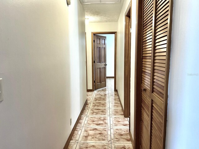 1811 Tawnee Pl, Brandon, FL 33510 - corridor featuring a textured ceiling, visible vents, and baseboards