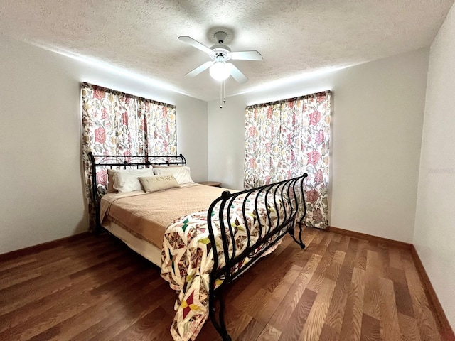 1811 Tawnee Pl, Brandon, FL 33510 - bedroom with a textured ceiling, wood finished floors, ceiling fan, and baseboards
