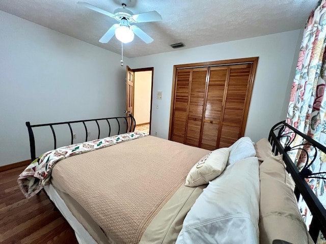 1811 Tawnee Pl, Brandon, FL 33510 - bedroom with visible vents, baseboards, a closet, wood finished floors, and a ceiling fan