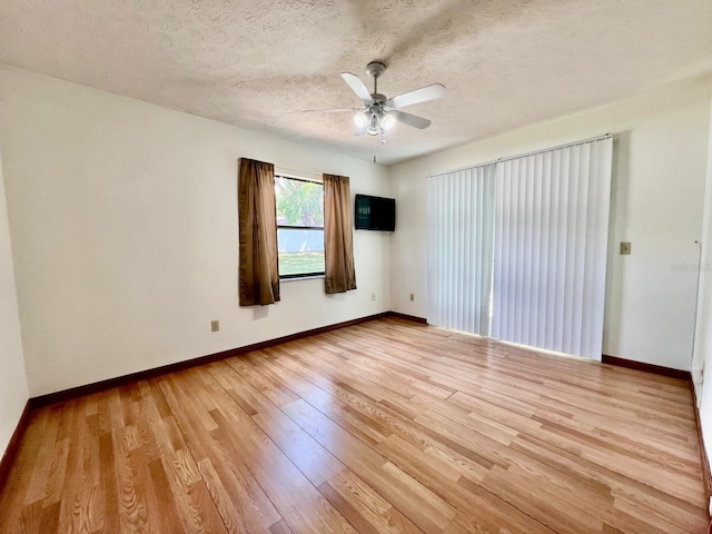 1811 Tawnee Pl, Brandon, FL 33510 - unfurnished room featuring light wood finished floors, a textured ceiling, ceiling fan, and baseboards
