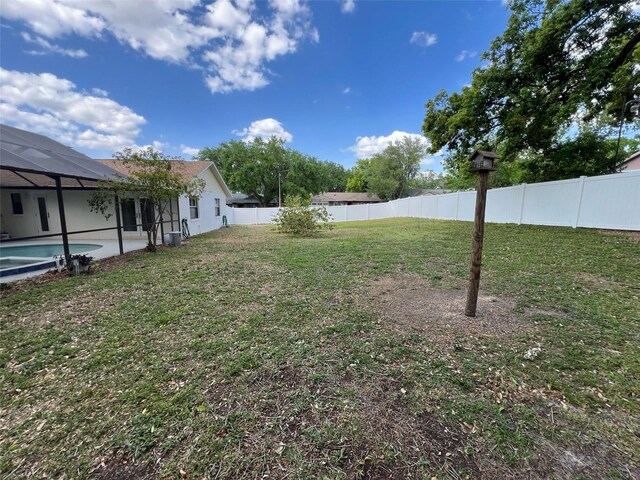 1811 Tawnee Pl, Brandon, FL 33510 - view of yard featuring glass enclosure, a fenced in pool, and a fenced backyard
