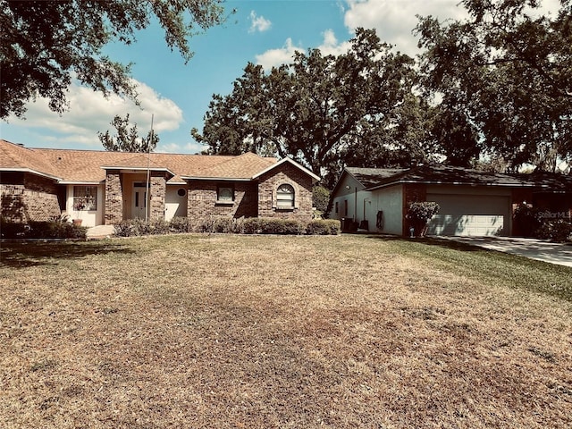 1811 Tawnee Pl, Brandon, FL 33510 - single story home with a garage, a front yard, and stone siding