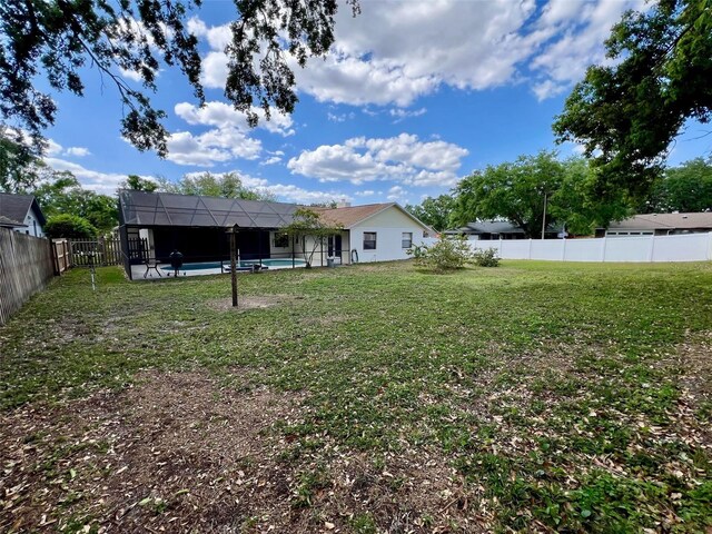 1811 Tawnee Pl, Brandon, FL 33510 - view of yard featuring glass enclosure, a fenced in pool, and a fenced backyard