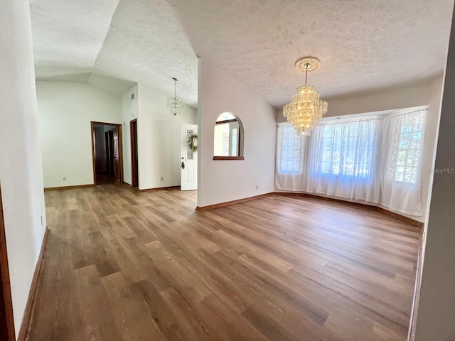 1811 Tawnee Pl, Brandon, FL 33510 - interior space with wood finished floors, a chandelier, a wealth of natural light, and a textured ceiling