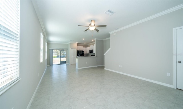 unfurnished living room with a ceiling fan, visible vents, crown molding, and baseboards