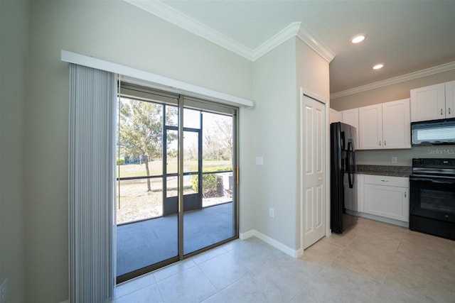 kitchen with light tile patterned flooring, baseboards, white cabinets, ornamental molding, and black appliances