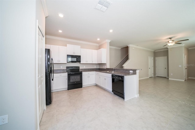 kitchen with a peninsula, a sink, open floor plan, black appliances, and crown molding