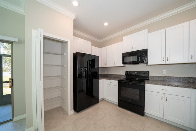 kitchen with dark countertops, black appliances, white cabinetry, and ornamental molding