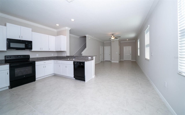 kitchen with crown molding, open floor plan, white cabinetry, a peninsula, and black appliances