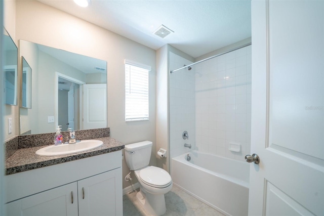 full bath featuring baseboards, visible vents, toilet, vanity, and shower / bathing tub combination