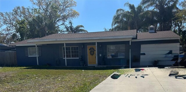 single story home with driveway, an attached garage, fence, a front lawn, and a porch