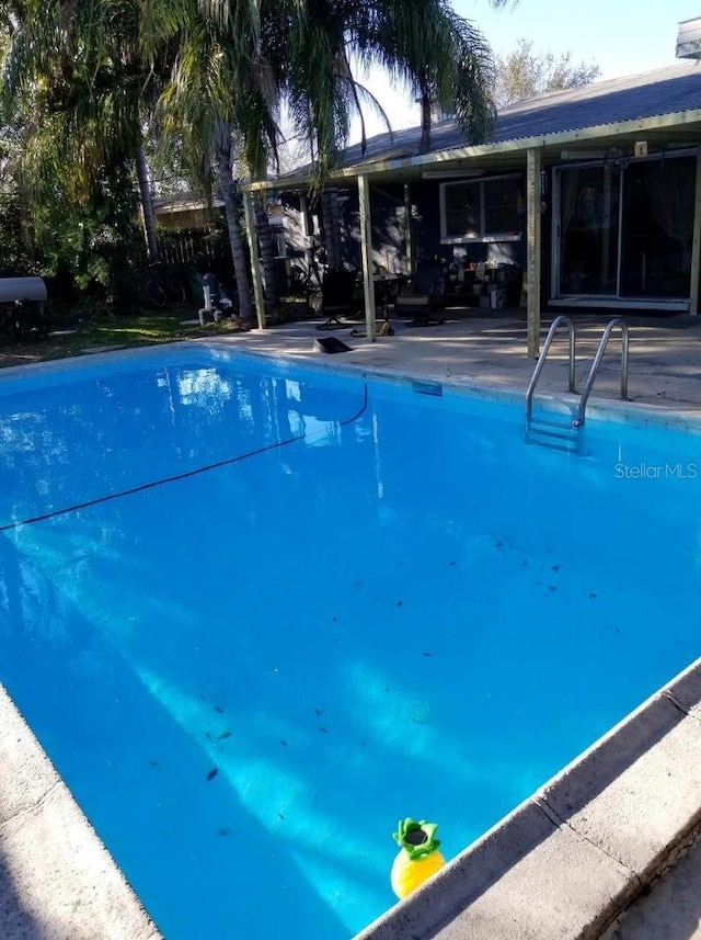 pool featuring a patio