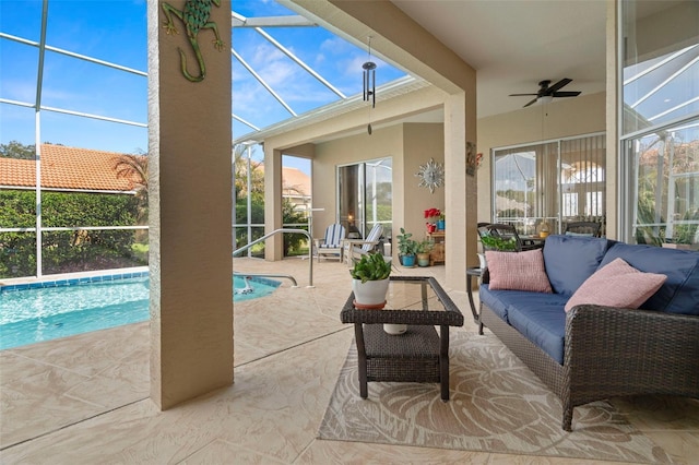 sunroom featuring ceiling fan