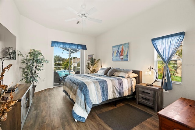 bedroom with access to exterior, visible vents, dark wood-style floors, and ceiling fan