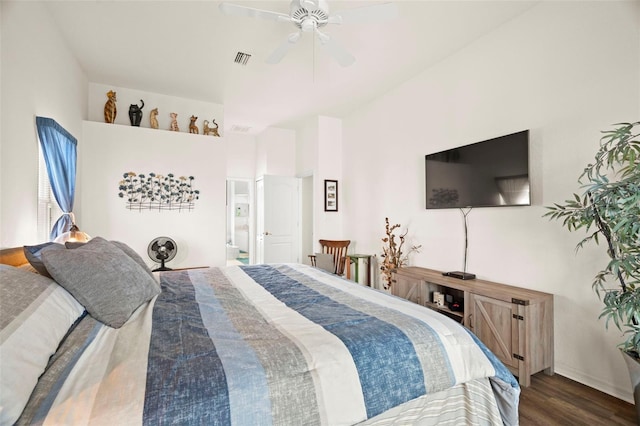 bedroom featuring ceiling fan, visible vents, wood finished floors, and ensuite bathroom