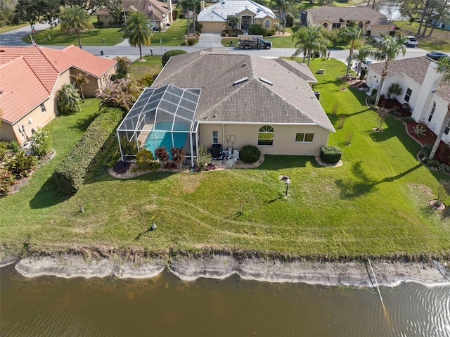 bird's eye view featuring a residential view and a water view