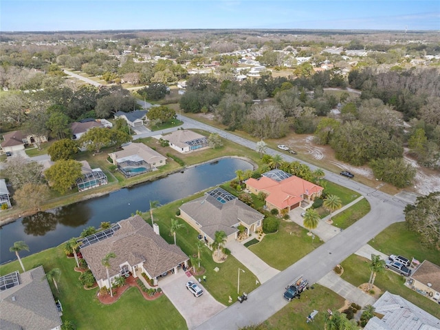 bird's eye view featuring a water view and a residential view