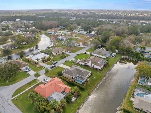 birds eye view of property featuring a residential view and a water view