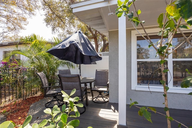 wooden deck featuring outdoor dining space