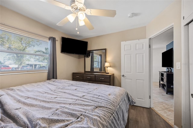 bedroom featuring ceiling fan and wood finished floors