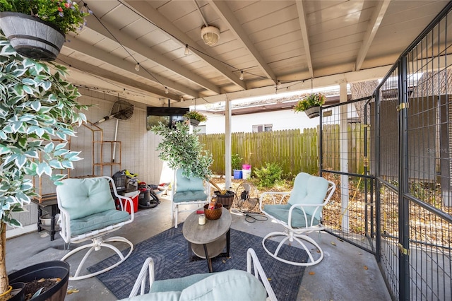 view of patio featuring fence