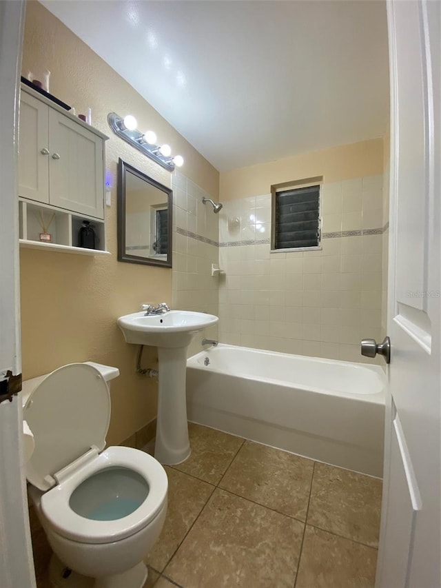 full bathroom with  shower combination, tile patterned flooring, and toilet