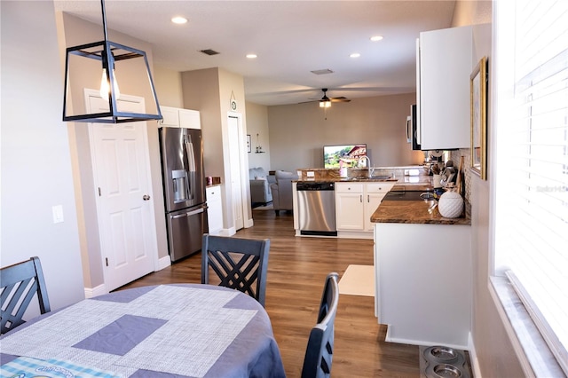 dining space featuring baseboards, visible vents, a ceiling fan, dark wood-style flooring, and recessed lighting